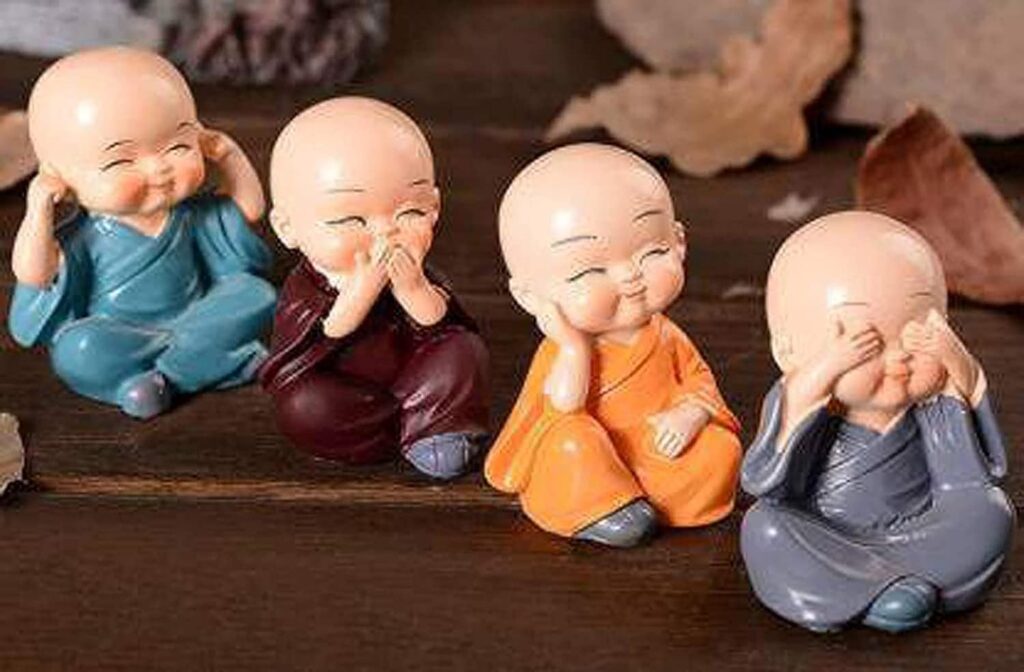 Car Dashboard Accessories Set of 4 Handcrafted Miniature Decorative Buddha Monk Figurines Polystone Showpiece for car dashboard in Multicolor