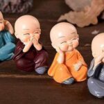 Car Dashboard Accessories Set of 4 Handcrafted Miniature Decorative Buddha Monk Figurines Polystone Showpiece for car dashboard in Multicolor