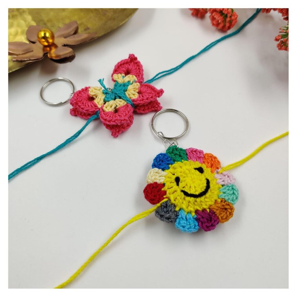 Prapti Handicrafts Handmade Eco-Friendly Crochet Cartoon Keychain Rakhi for Kids, Boys/Girls (smily sunflower+butterfly)